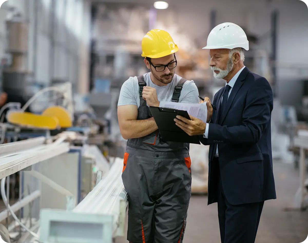 Factory meeting between supervisor and worker