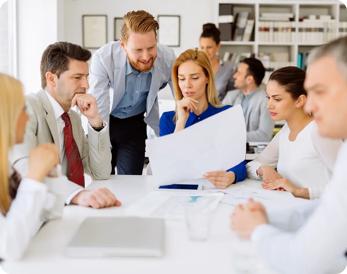 Business team discussing documents at table